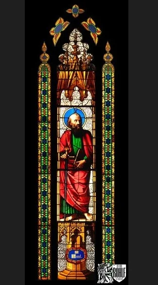 A tall figurative stained glass lancet restored for Fordham University.